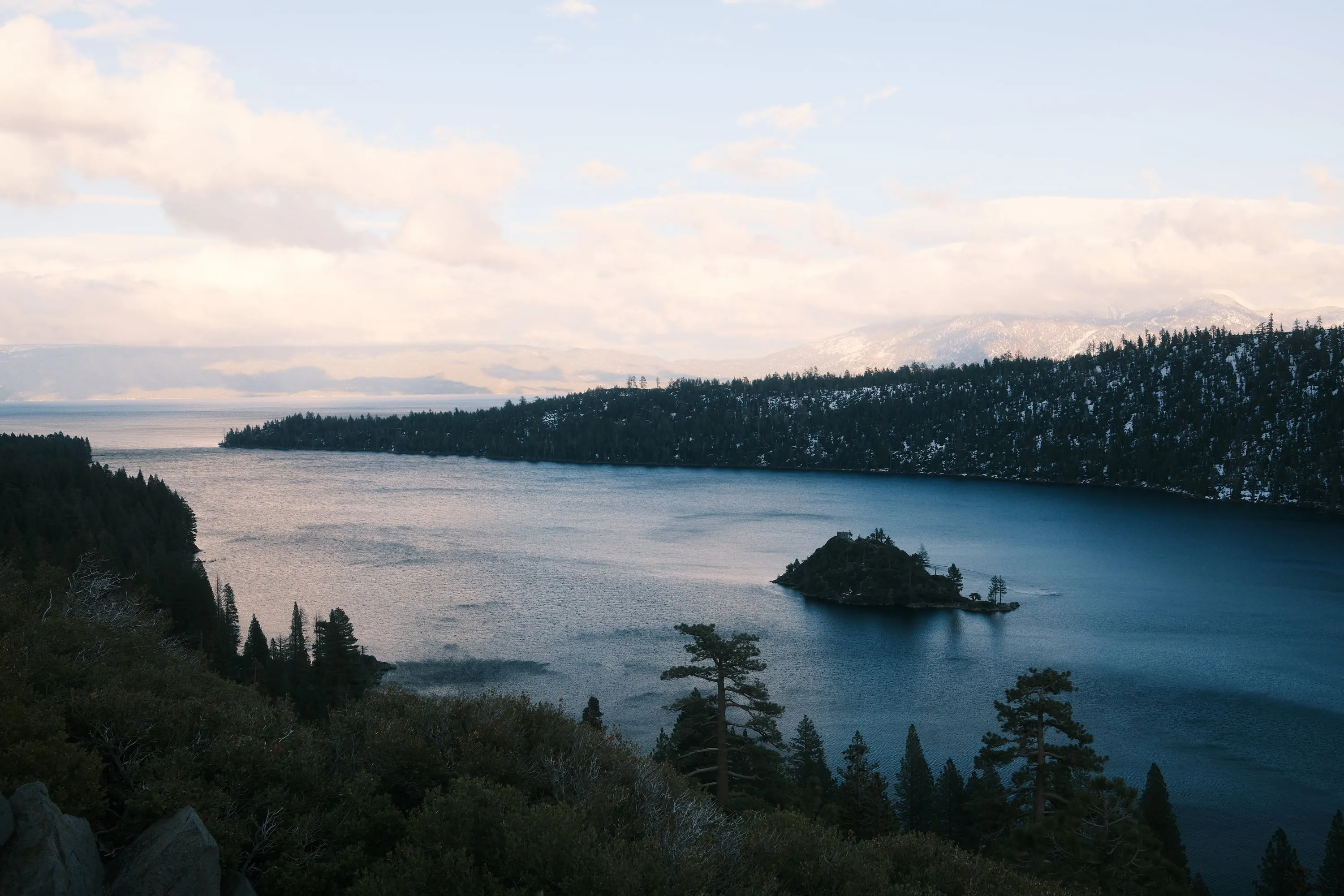 Snow — The bay and its island, seen from the road above.