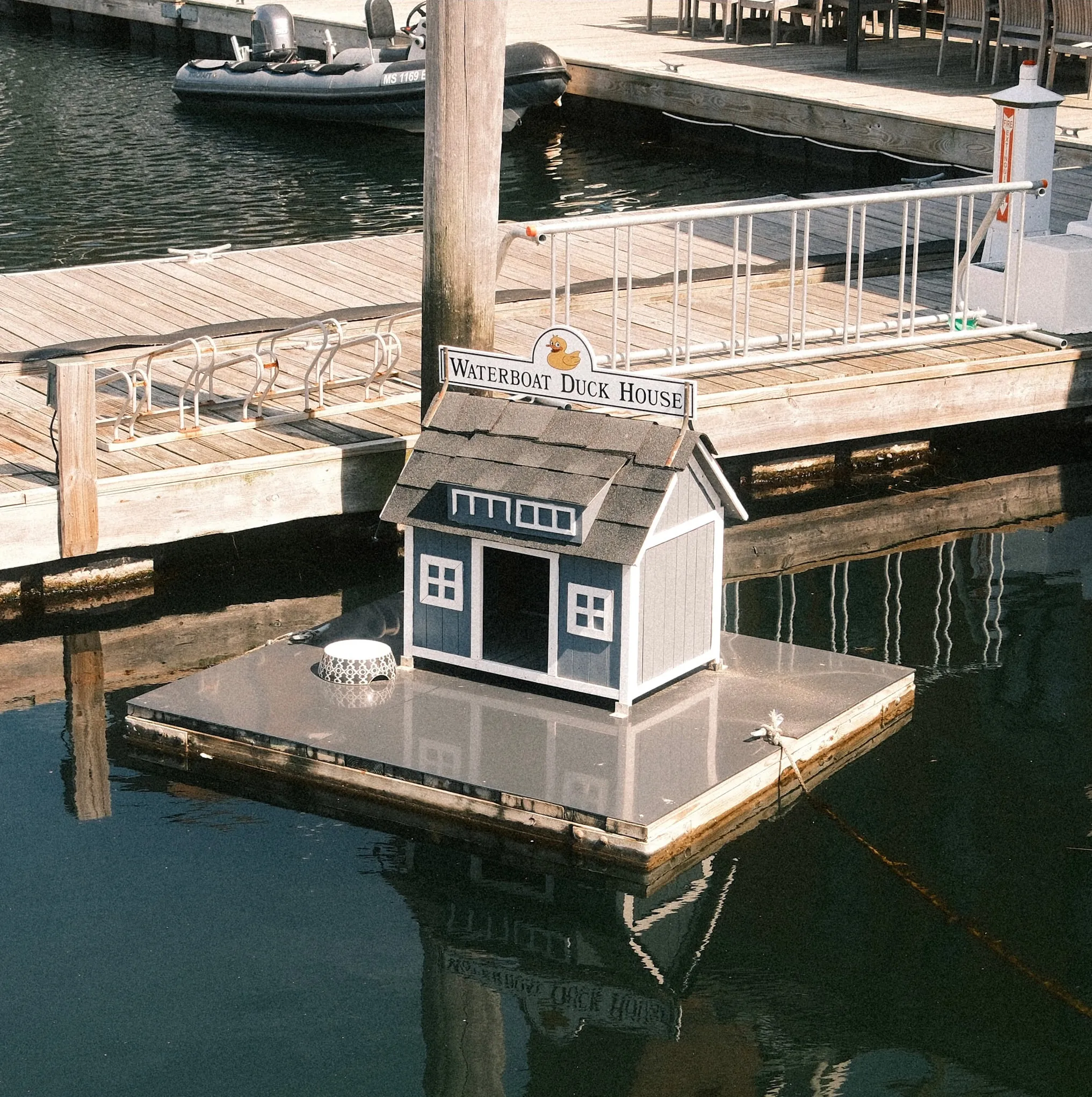 A duck house of its own, moored off the pontoon.